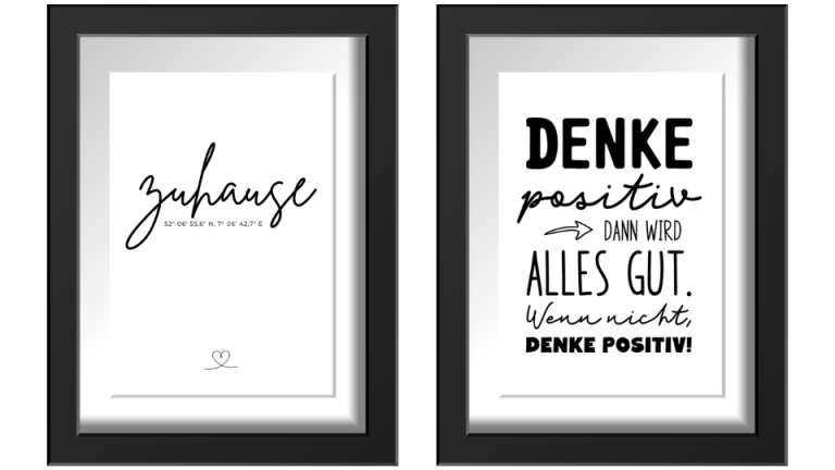 Zwei gerahmte Drucke mit motivierenden Sprüchen in Schwarz-Weiß.